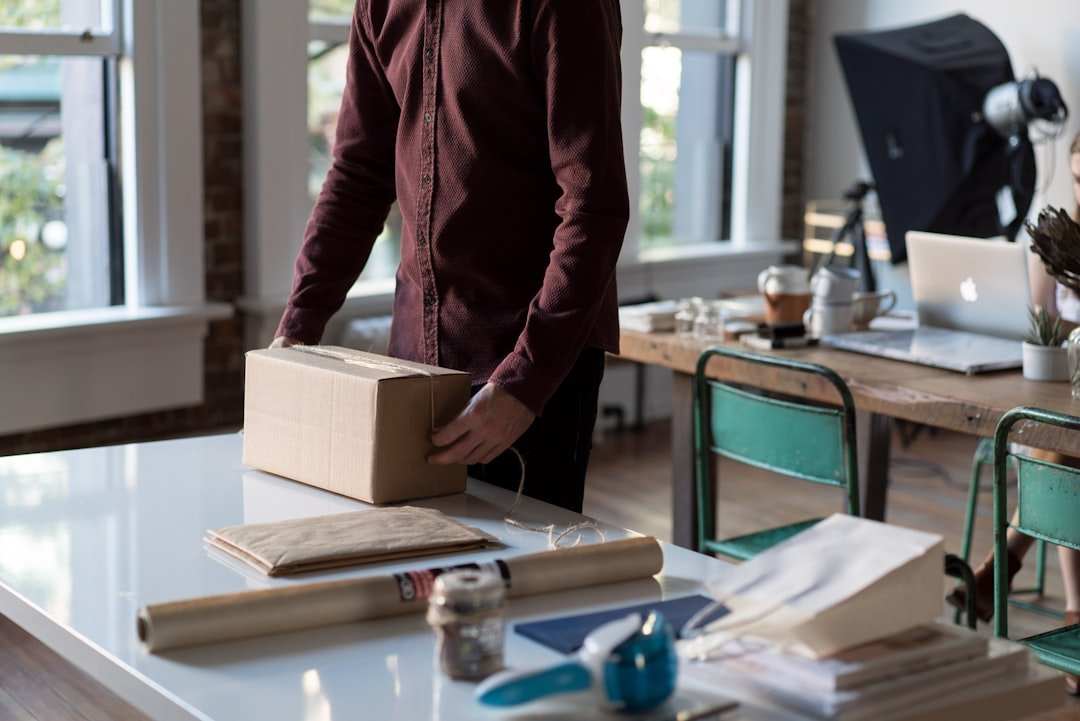 Small-business operator planning work at a desk.